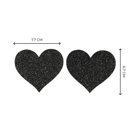 Midnight black glitter heart-shaped nipple covers, reusable and breathable for pole fitness and exotic dance routines.