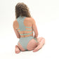 Pole wear set in Mystical Mind Glitter. Stunning photo showing strappy back of Mystical Mint  - Cheeky Glitter shorts In Mystical MintGlitter Pole Set.