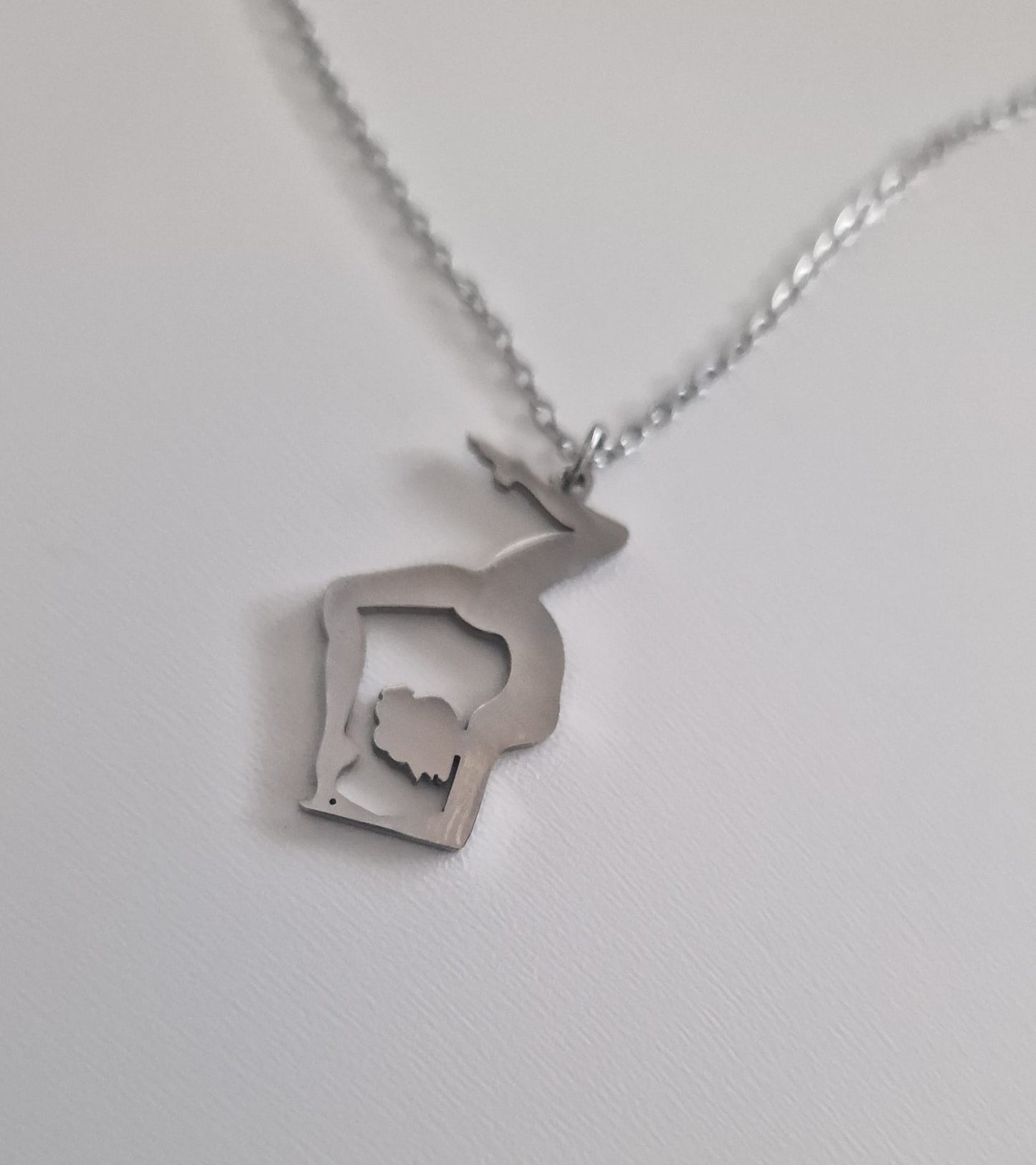 Polished Stainless Steel Gemini Pole Dance Necklace with pendant depicting a pole dancer in an inverted pose