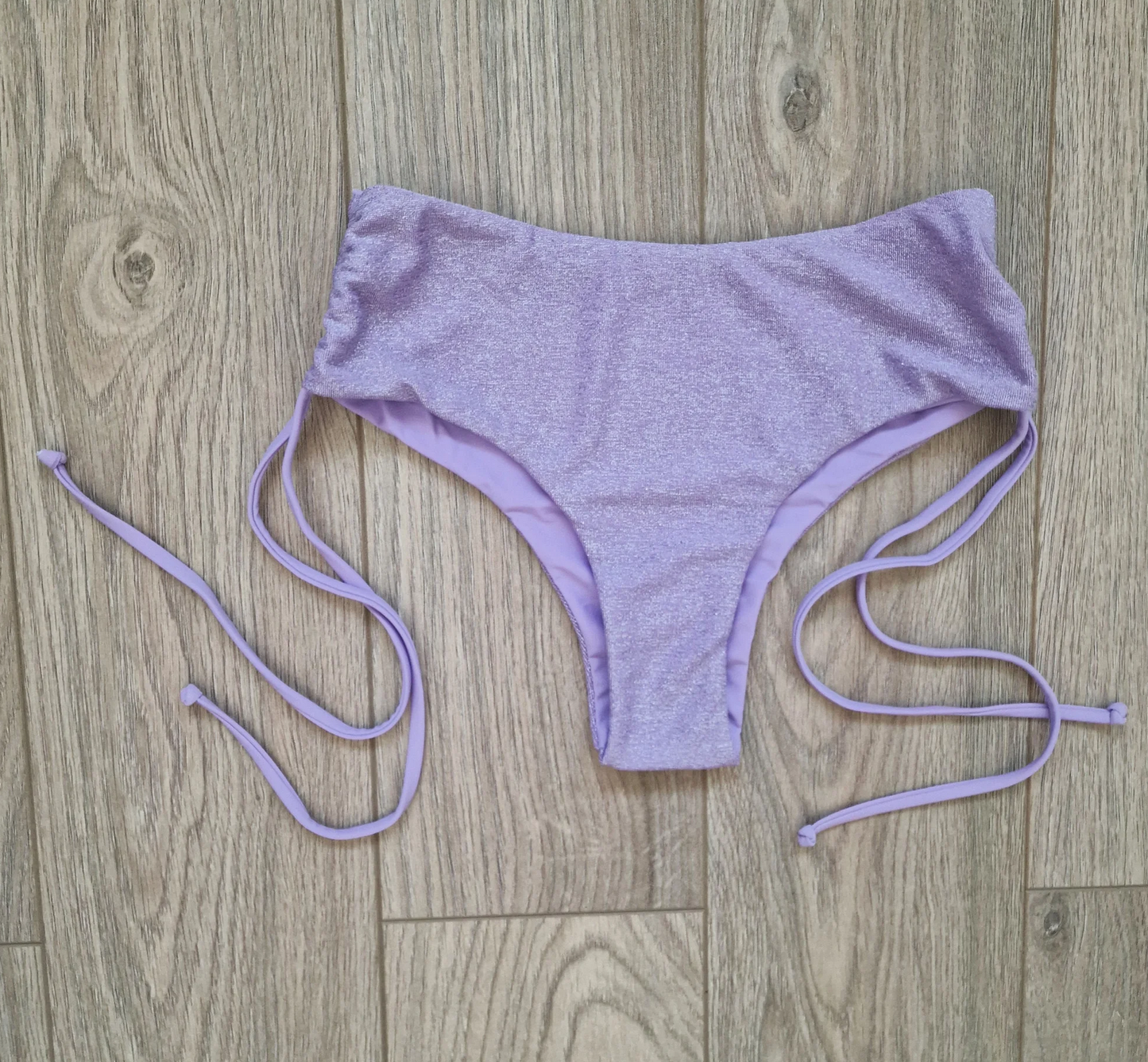 Back view of Luscious Lilac Glitter Cheeky Shorts. Highlights the full coverage design and glitter detail, designed for comfort and style in pole dancing.